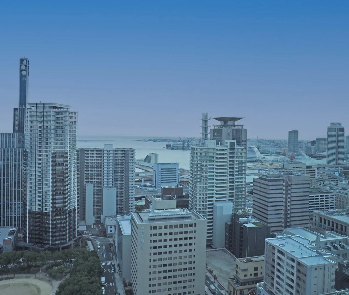 Urban landscape with skyscrapers and sea background